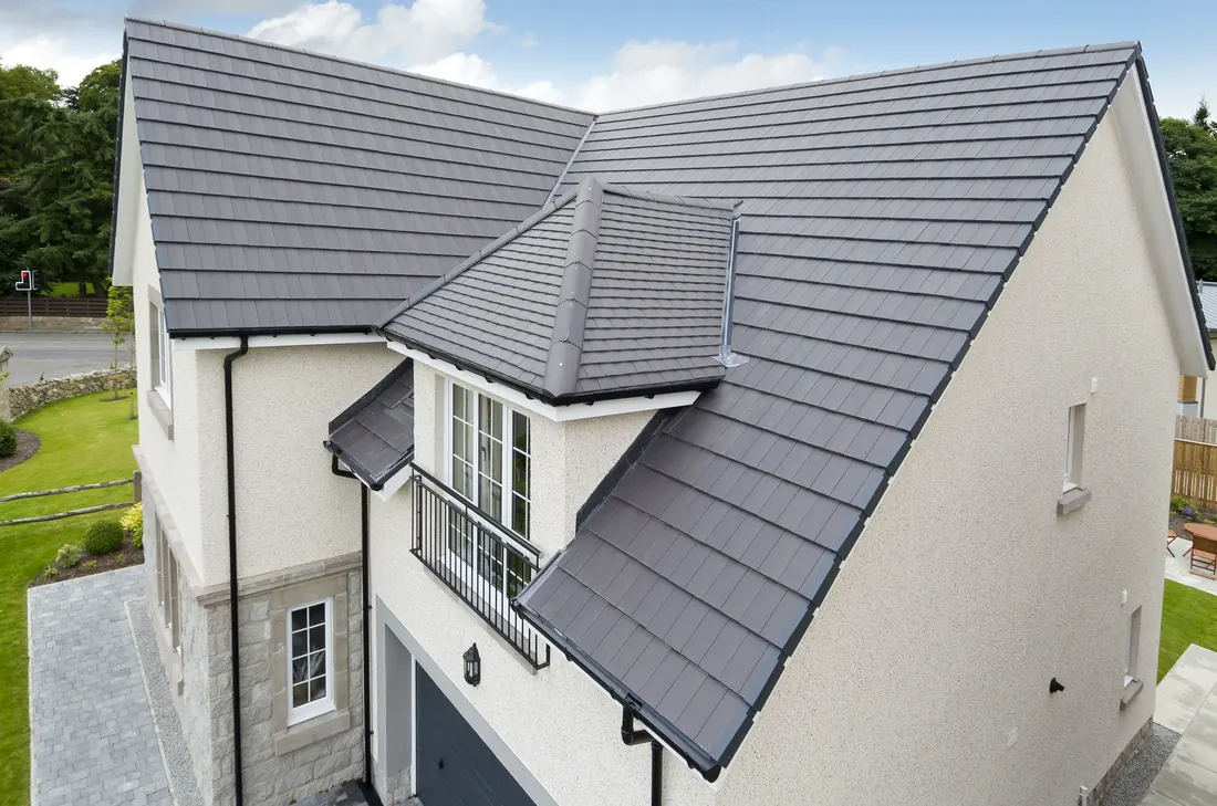 A newly completed grey tiled pitched roof by Tammat Group