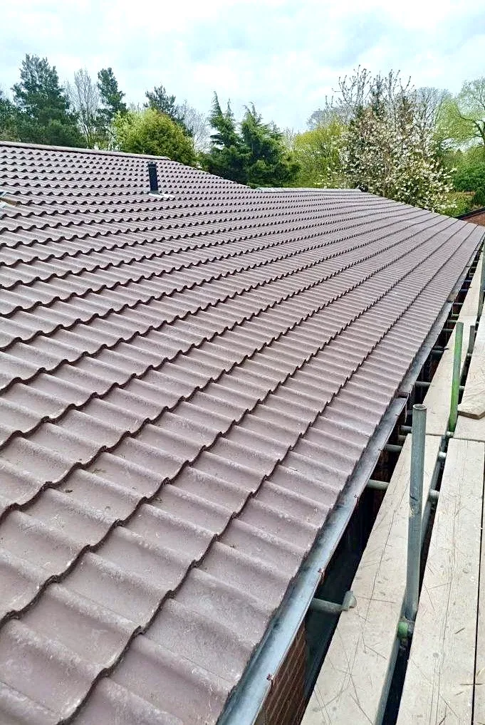 A freshly completed brown pantile pitched roof by Tammat Group