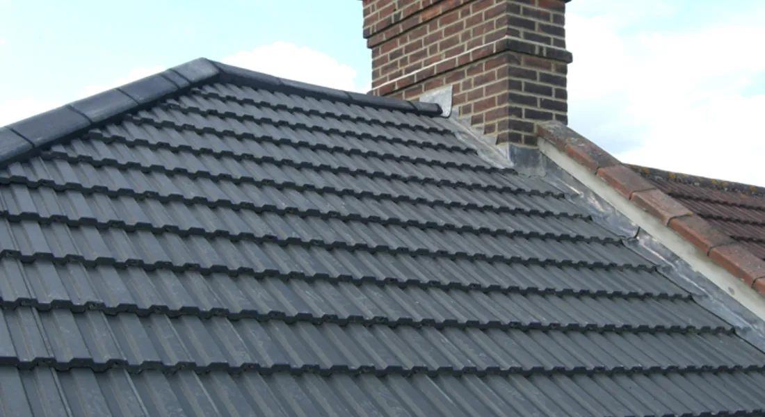 A new grey pantile re-roof with chimney and leadwork by Tammat Group